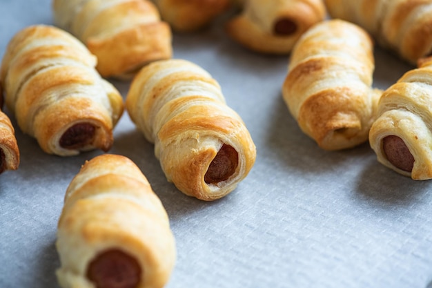 Pigs in a blanket mini rolls with sausages wrapped in a puff pastry dough