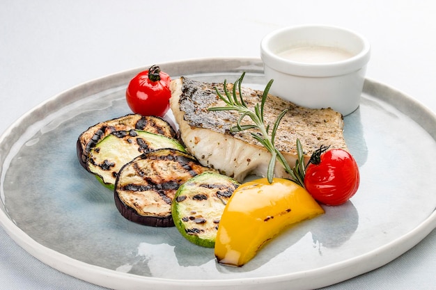 Pike perch fillet with grilled zucchini with white sauce