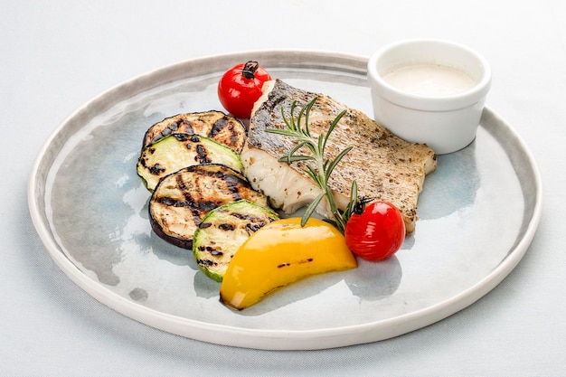 Pike perch fillet with grilled zucchini with white sauce