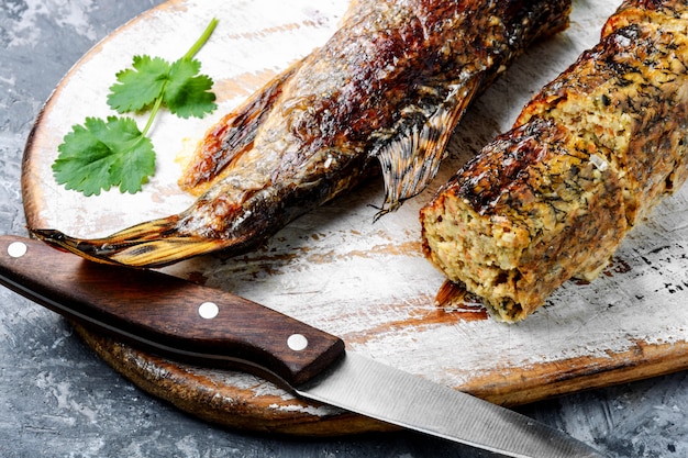 Pike stuffed with vegetables