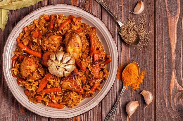 Pilaf (biryani) on a wooden background