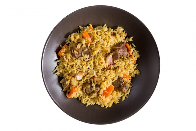 Pilaf met lamsvlees, wortelen, uien, knoflook, peper en berberis. Een traditioneel gerecht uit de Aziatische keuken.
