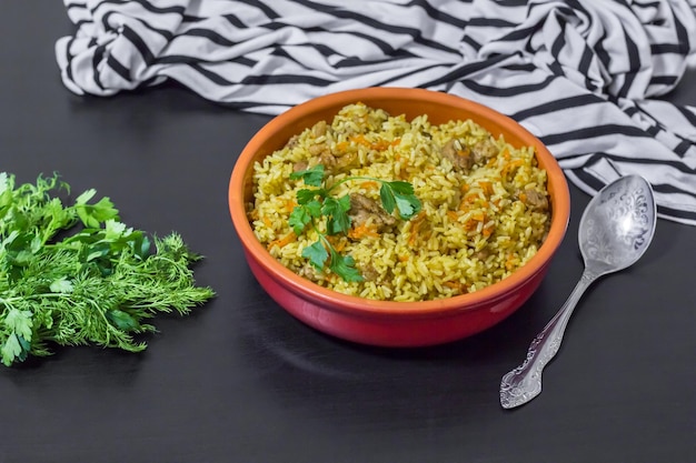 Pilaf with beef carrots onions garlic pepper and cumin A traditional dish of Asian cuisine