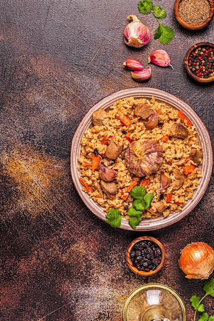 Pilaf with meat, vegetables and spices, top view.