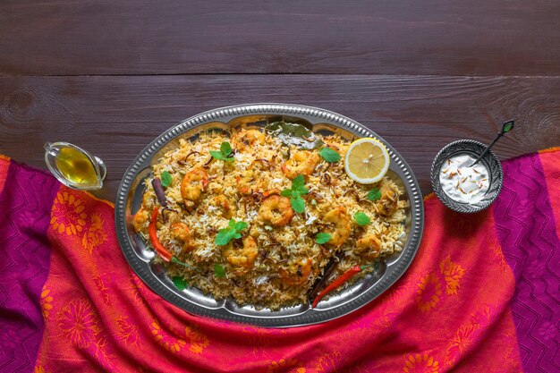 Pilaf with shrimp. Tasty and delicious prawns biryani, top view, copy space