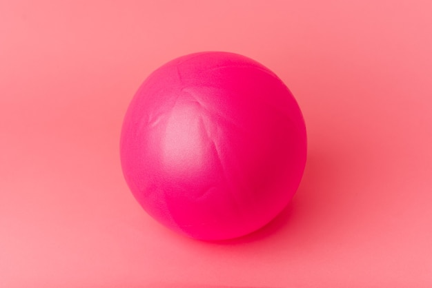 Pilates ball isolated on pink background