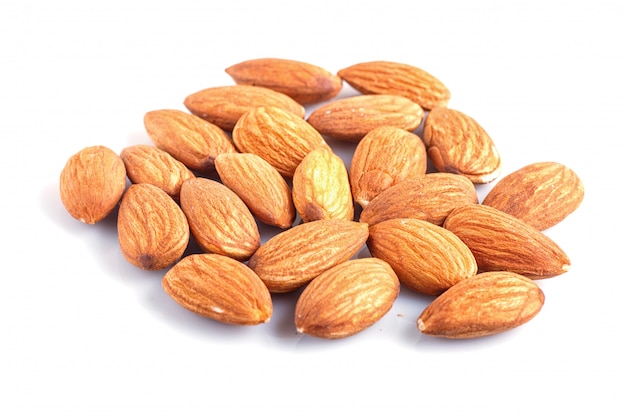 Pile of almonds isolated on white background