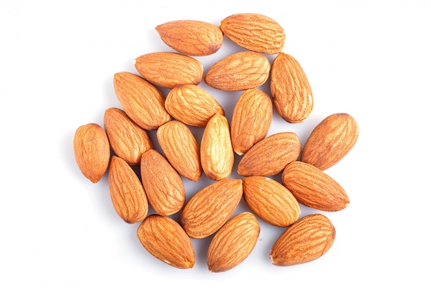 Pile of almonds isolated on white background