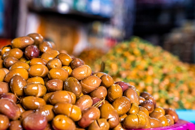 Pile of argan nuts and seeds for selling on street marketplace