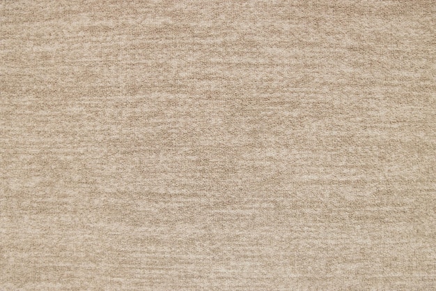 Mucchio di moquette beige sullo sfondo della struttura