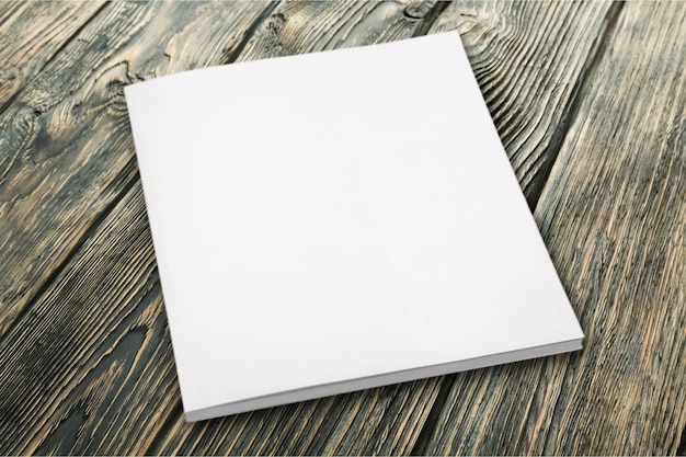 Photo pile of blank paper on wooden table