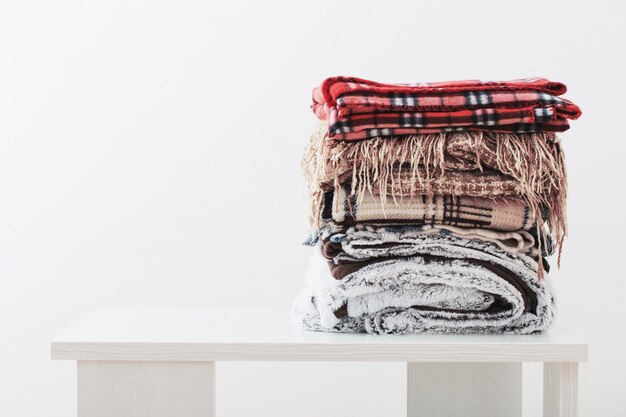 Photo pile of blankets on a white space