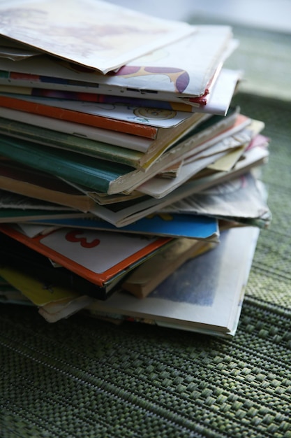 Pile of books on window board close up