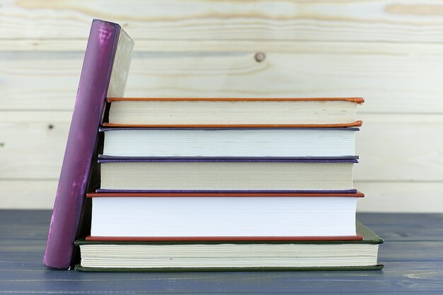 A pile of books with library on the back