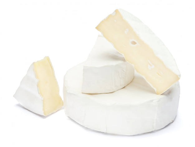 Pile of brie or camambert cheese on a white space