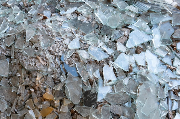 A pile of broken multicolored glass Factory for recycling glass waste The concept of renewable raw materials