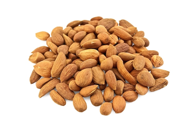 Pile of brown almonds isolated on white background