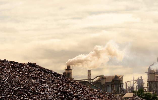 Pile of brown bottle for recycle in recycling factory Glass waste for recycle CO2 emissions Carbon