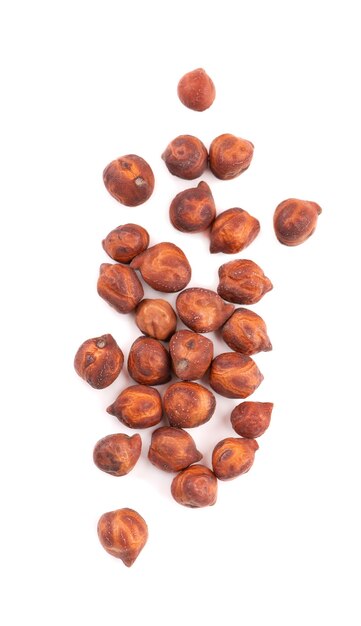 Pile of brown chickpeas, isolated on white background. Brown chickpea. Garbanzo, bengal gram or chick pea bean. Top view.