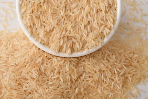 Pile of brown rice on white