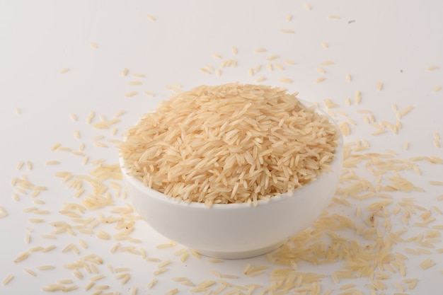 Pile of brown rice on white