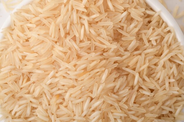 Pile of brown rice on white