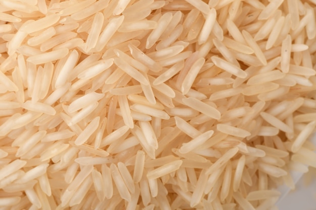 Pile of brown rice on white