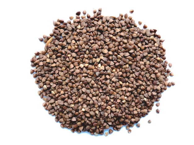 Pile of buckwheat isolated on white background. Top view.