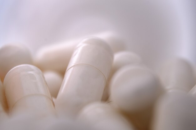 Pile of capsules, close up, medicines background.