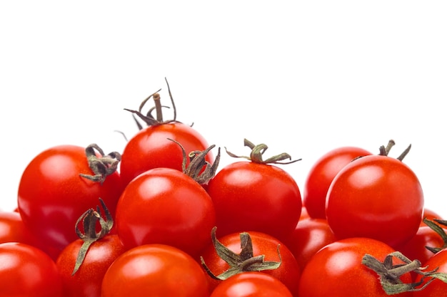 Pile of cherry tomatoes on white background close up