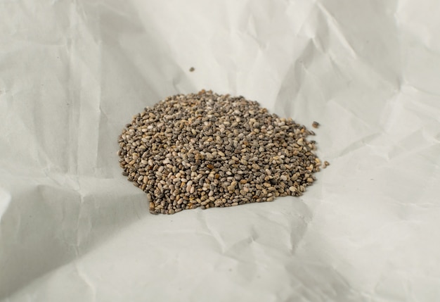 Pile of Chia Seeds in Wrapping Parchment Paper