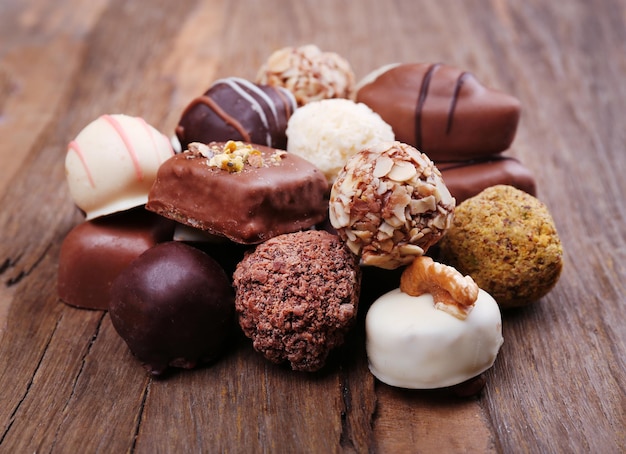 Pile of chocolate candy on wooden rustic background