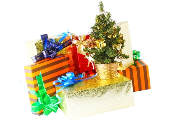 Pile of Christmas and New Year gift boxes. Isolated over white background