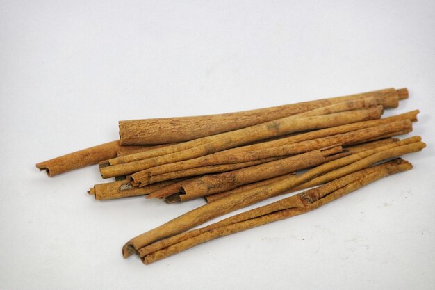 a pile of cinnamon sticks on a table