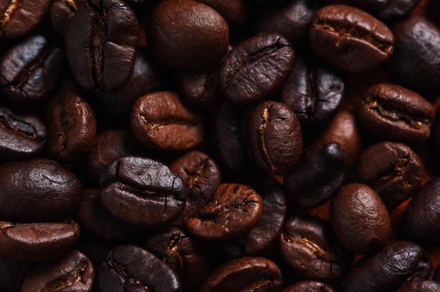 A pile of coffee beans with the word coffee on the top