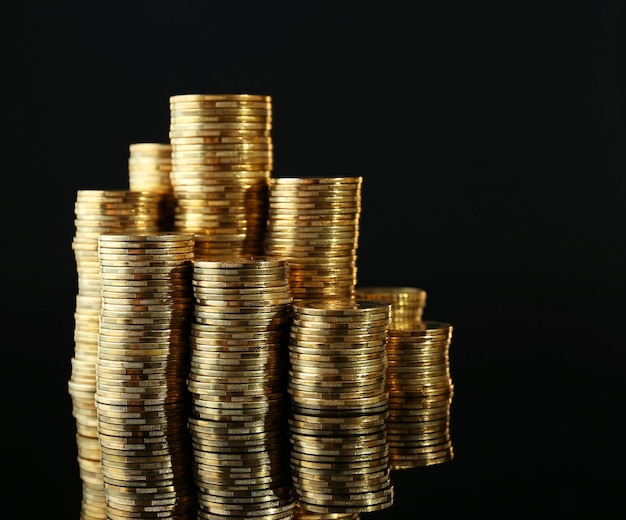 Pile of coins on dark background