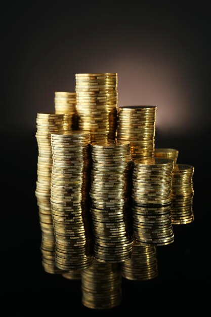 Pile of coins on dark background