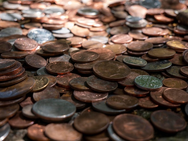 Pile of coins different European and American metal coins money background