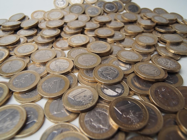 A pile of coins with the word euro on them