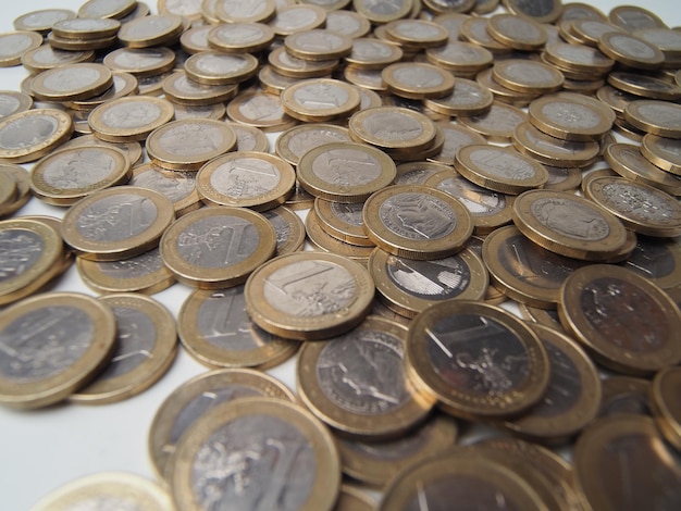 A pile of coins with the word euro on them