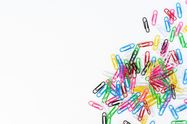 Pile of colored paper clips isolated on a white 