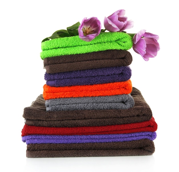 Pile of colorful towels isolated on white