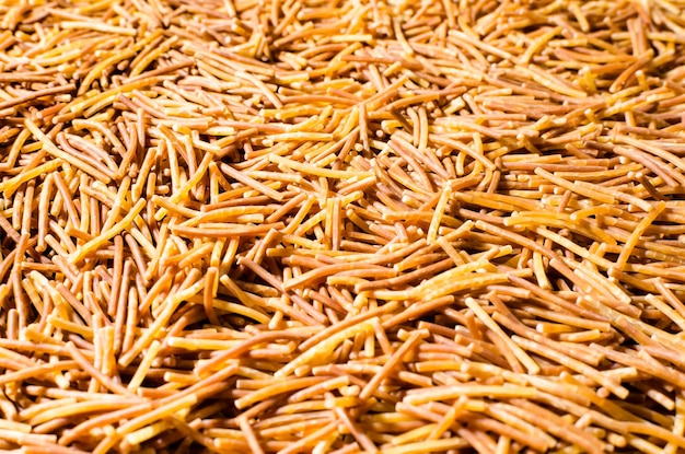 Pile of cooked polyphosphate noodles