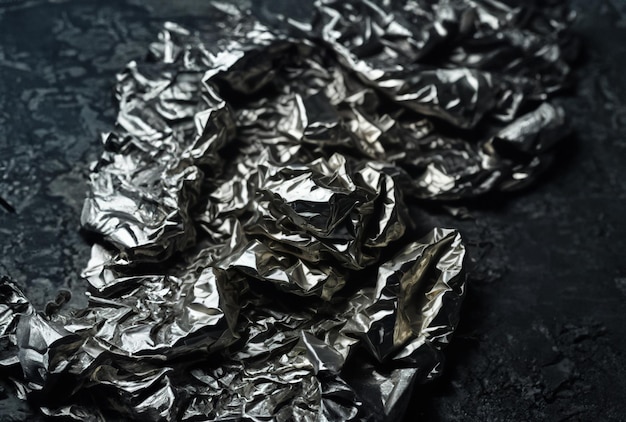 A pile of crumpled aluminum foil with the word " b " on it.