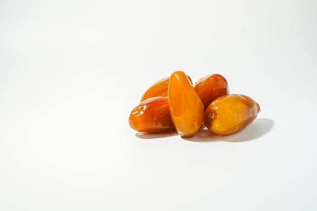 A pile of dates on a white background