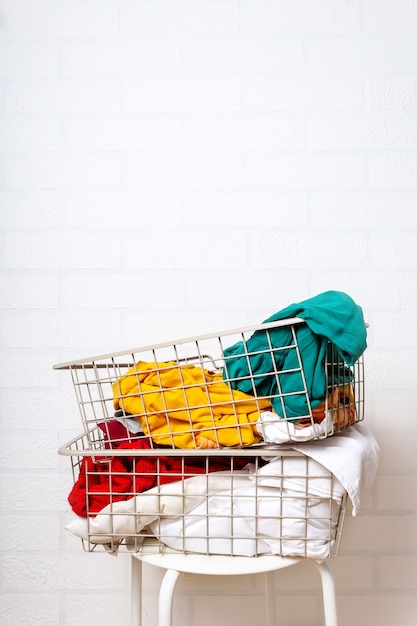 Pile of dirty colorful laundry in baskets