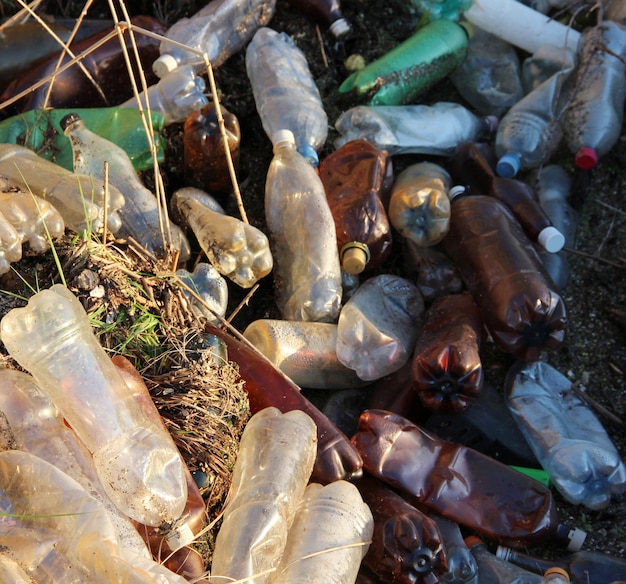 Pile of dirty plastic bottles, top view.