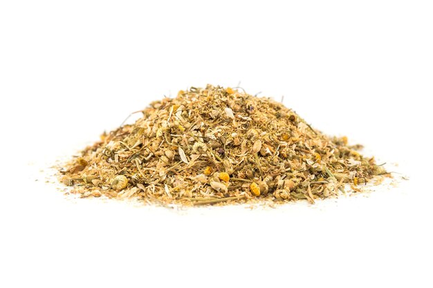 A pile of dried chamomile flowers. Side view