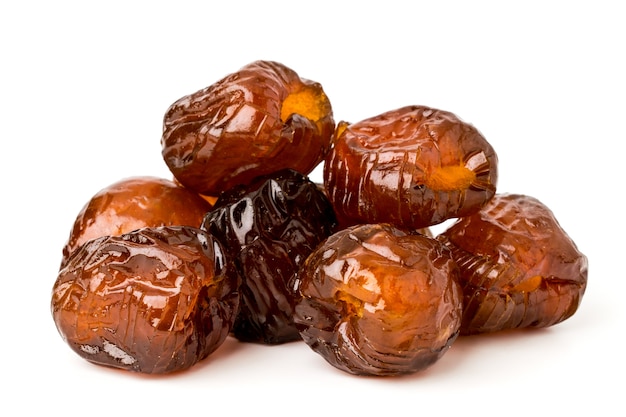 Pile of dried dates, pitted against a white, isolated