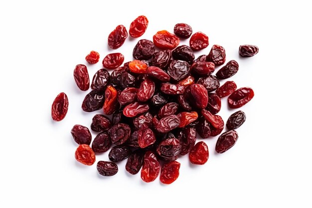 a pile of dried raisins on a white surface